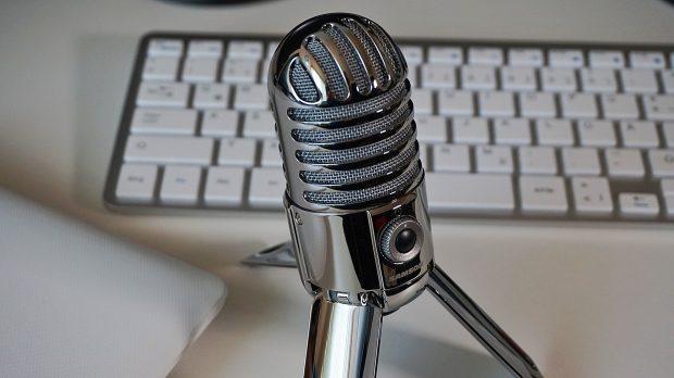 A desktop microphone for use in a podcast.