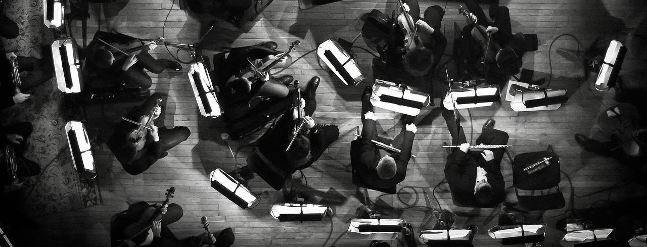 Aerial shot of an orchestra providing a layering composition