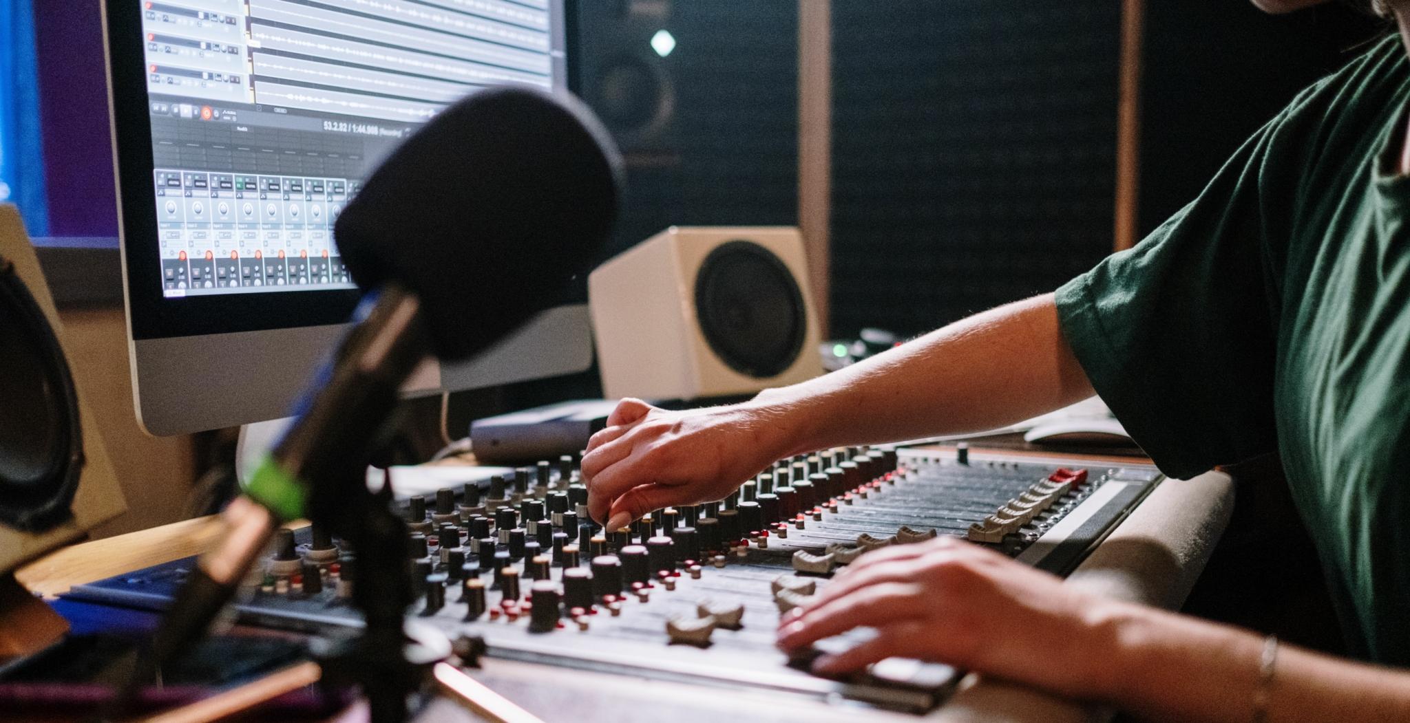 Audio mixing session with a mixing console and DAW