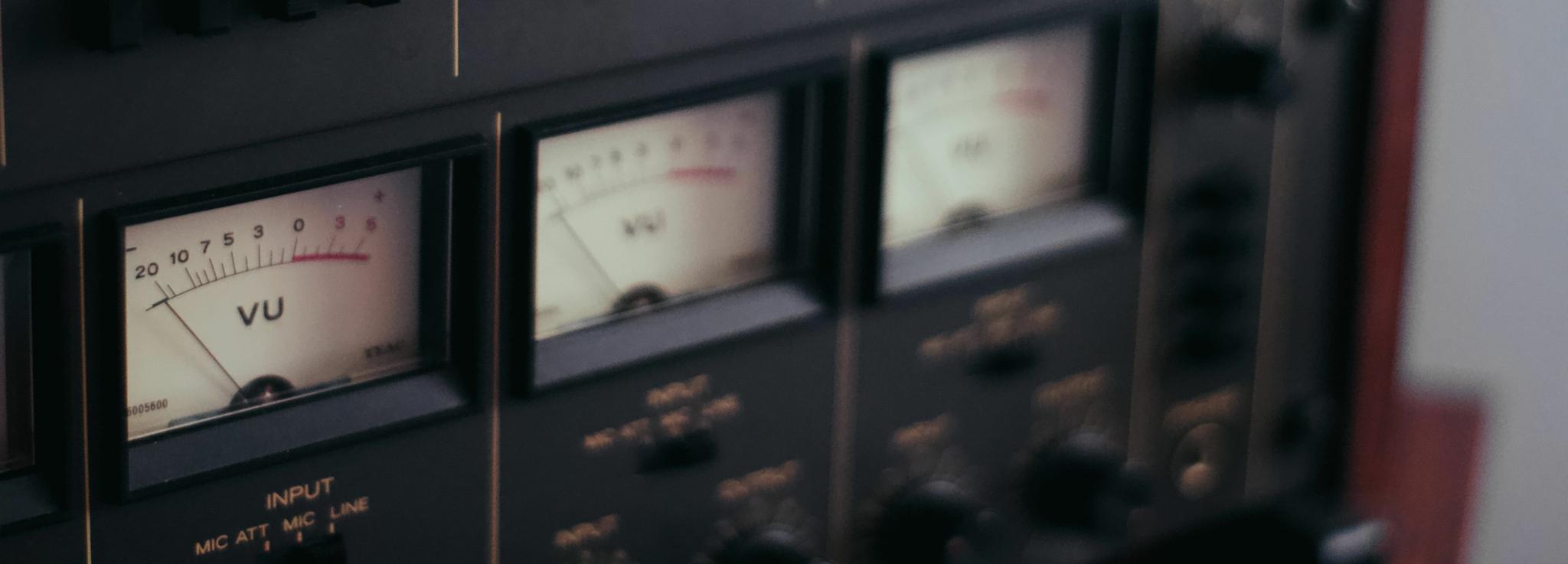 Vintage rackmount audio processor with analog VU meters and control switches