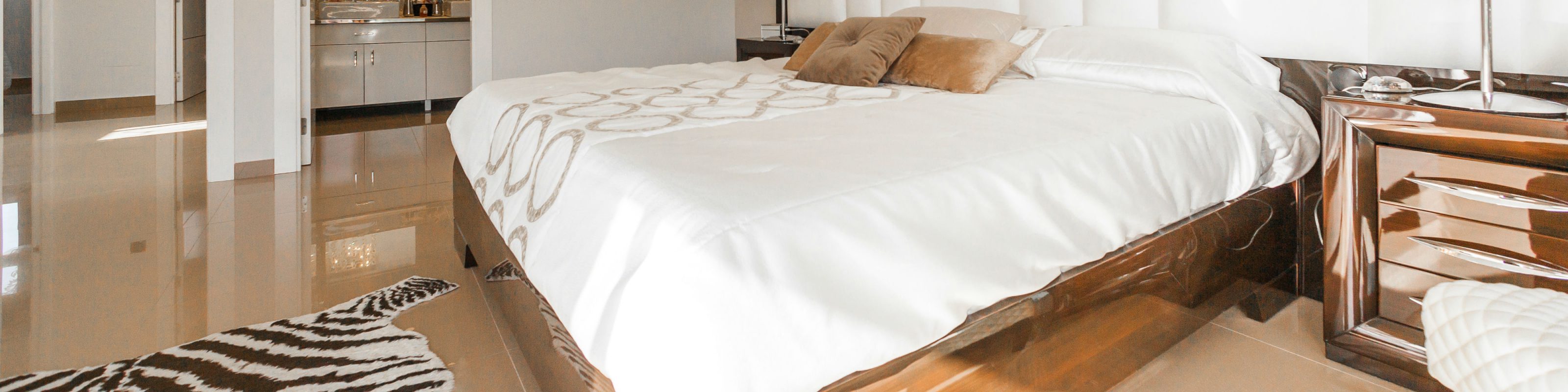 A bedroom with various surface types