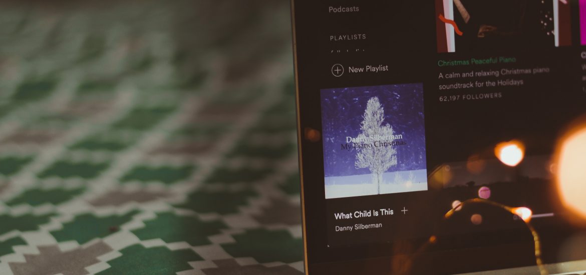 A laptop displaying new Spotify playlists