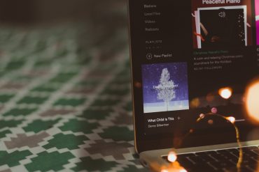 A laptop displaying new Spotify playlists