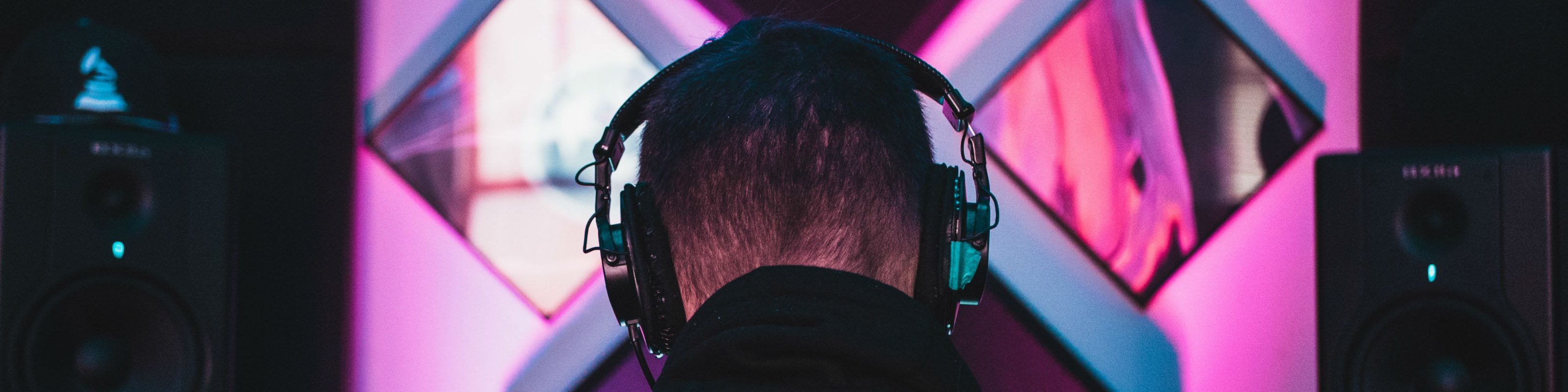 A producer with symmetrical studio monitors