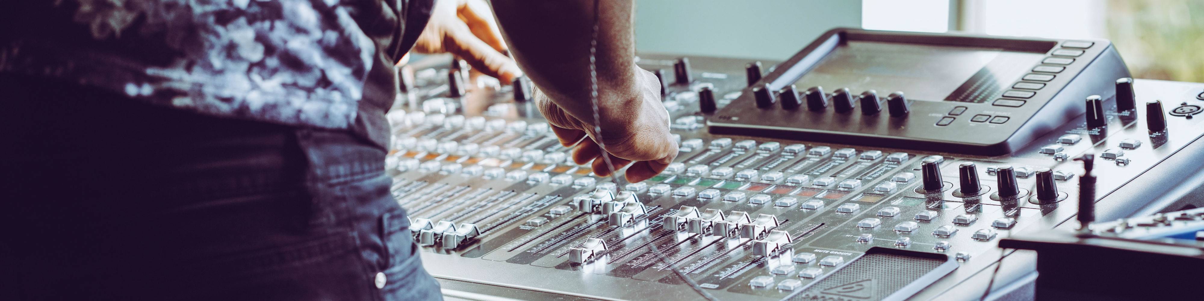 An engineer mixing on a desk