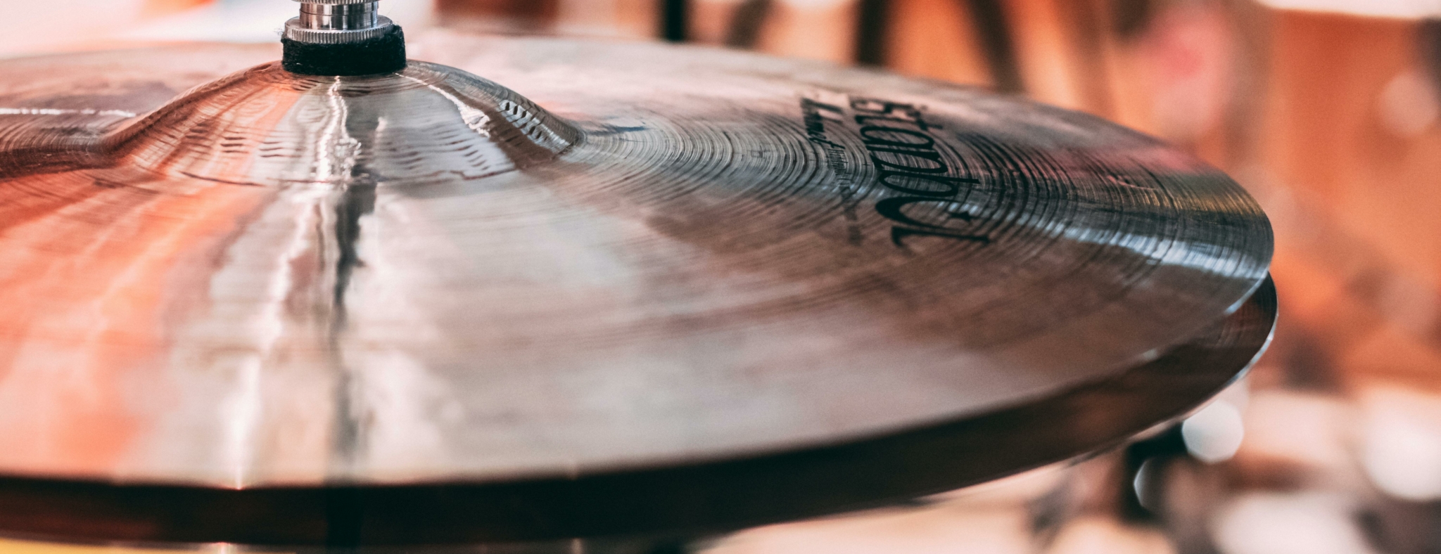 Close-up of a cymbal in a recording studio setting.
