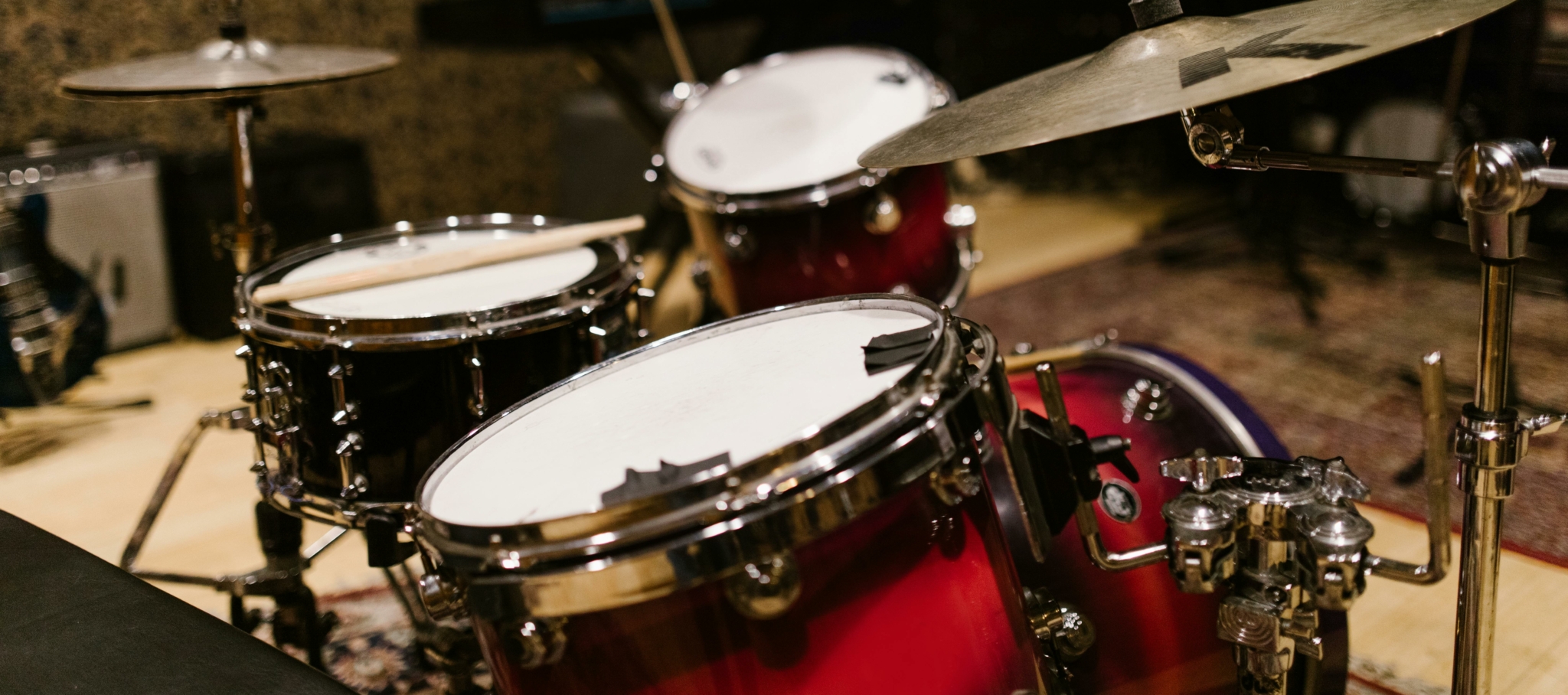 Close-up view of a, acoustic drum set with cymbals in a music studio.